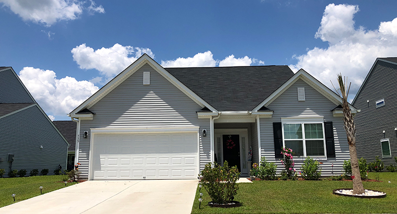 gray one story home with garage sophia landing