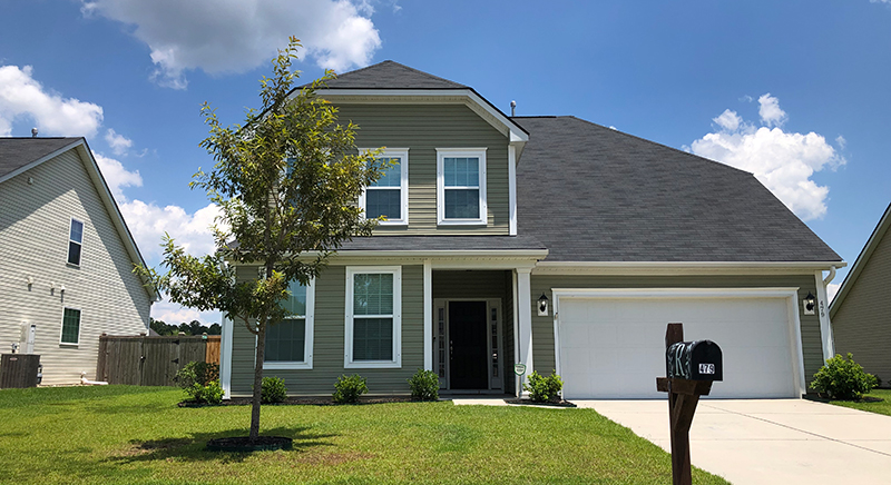 green two story home sophia landing