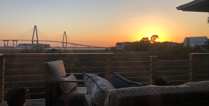 The Ravenel bridge leading to downtown charleston at sunset.png