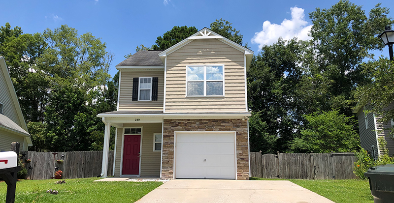 two story tan home in brickhope greens