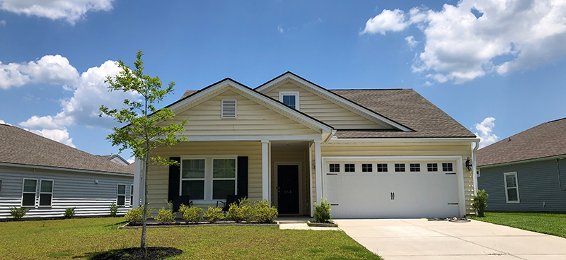 two story yellow home in brickhope plantation