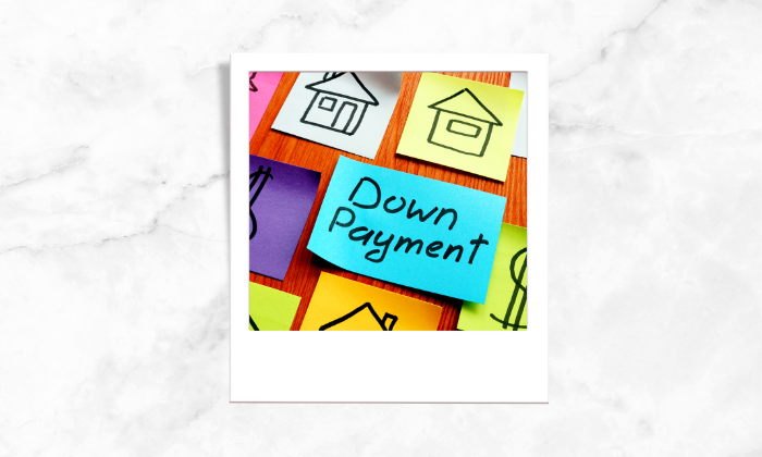 A photo of sticky notes showing down payment and relevant symbols