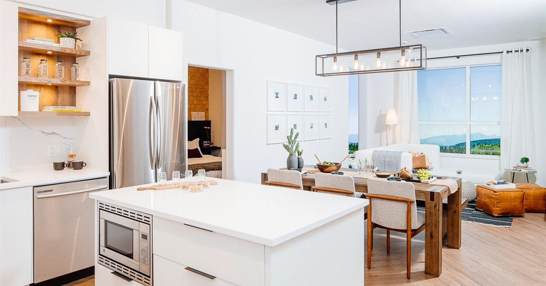 Photo showing kitchen island and dining room at Clyde Port Moody