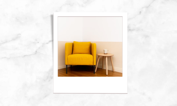 Photo of a cozy sofa chair and a table