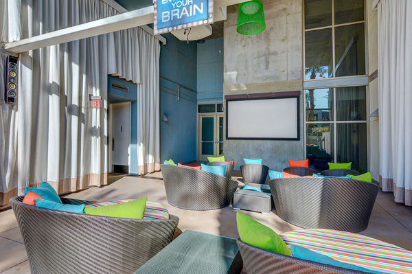 Poolside outdoor screening area at Juhl, a luxury condominium building located in downtown Las Vegas, Nevada.