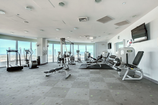 The fitness center at Newport Lofts high rise condo building in Las Vegas