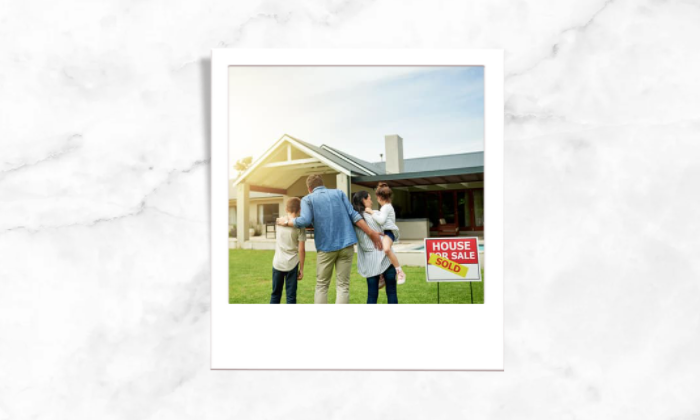 Photo of a family who bought their own house