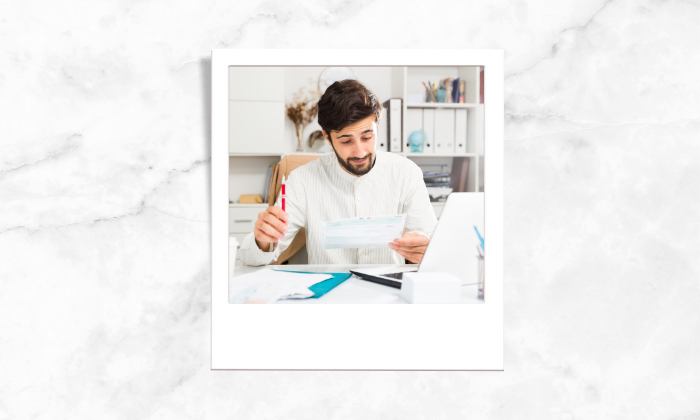 Photo of a person assessing some documents