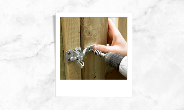 Photo of a person fixing the fences