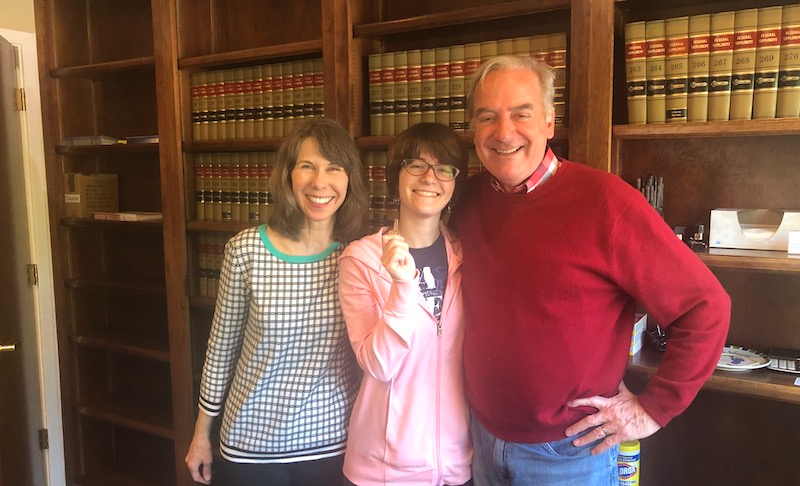 Young Woman Closing on her Starter home with parents