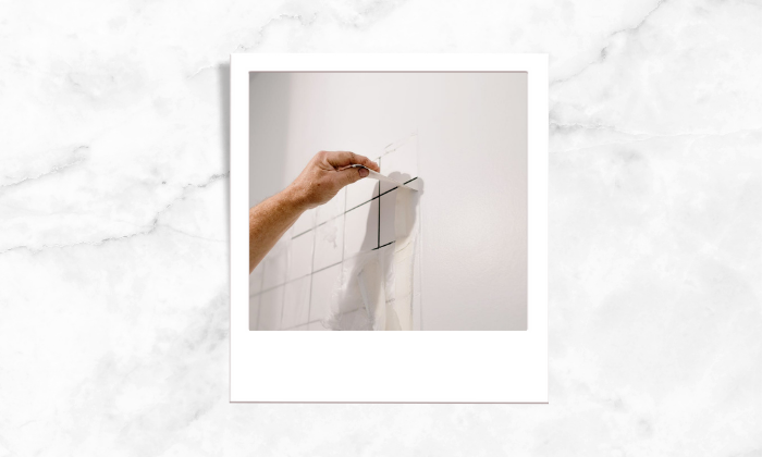 Photo of a person revamping old tiles