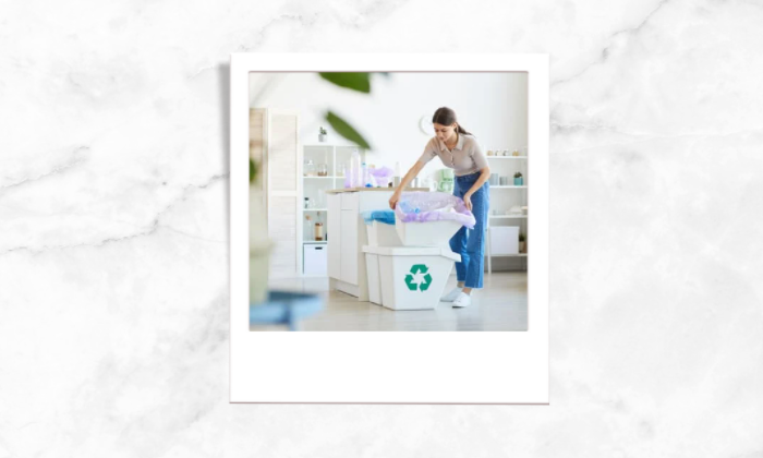 Photo of a person cleaning the trash bins