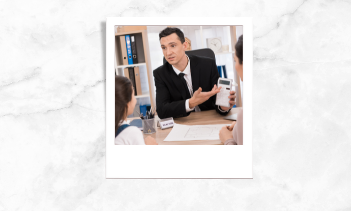 Photo of a realtor showing a computed value to his clients