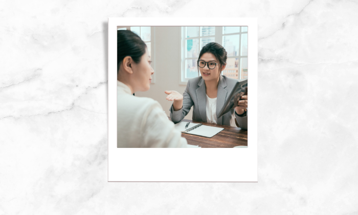 Photo of a realtor explaining to her client