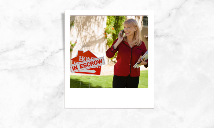 Photo of a relator standing beside an escrow signage