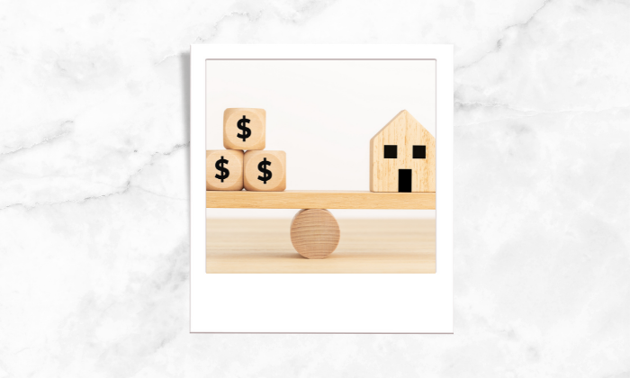 Photo of wooden blocks and house being balanced together