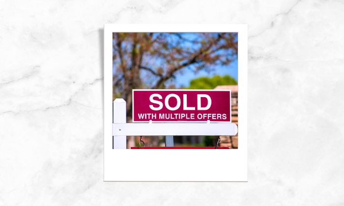 Photo of a sold with multiple offers signage