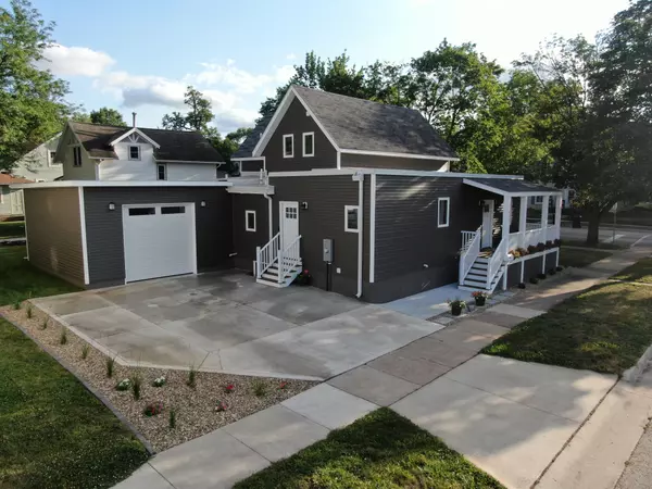 Brown Two-Story House with Driveway