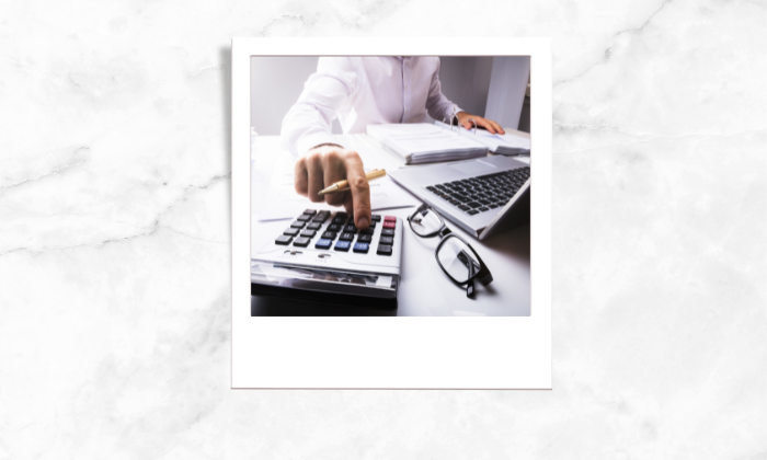 Photo of a person using calculator