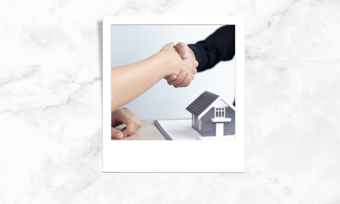 Photo of two people shaking each other hands