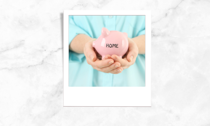 Photo of a person holding a piggy bank