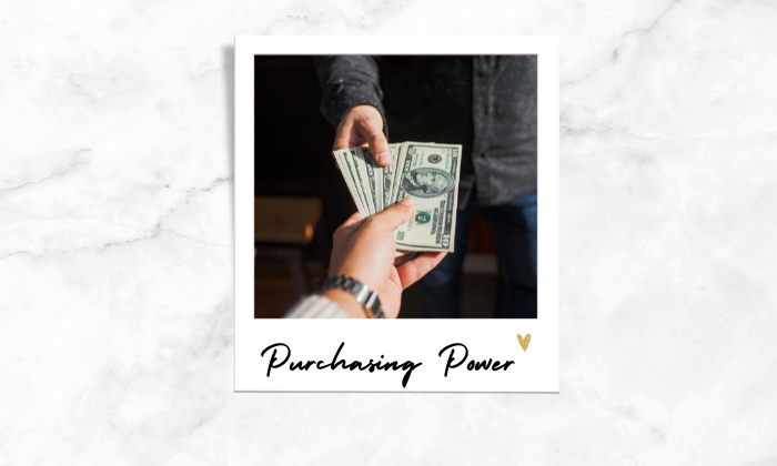 Photo of two people handing some money 