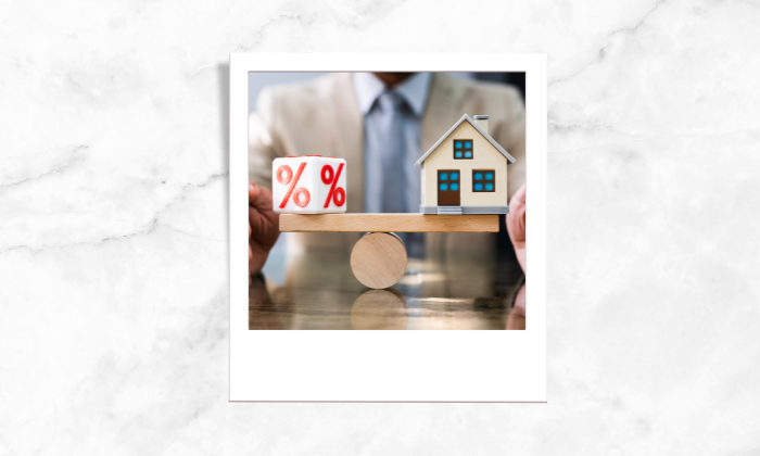 Photo of a dice and a house being balance together