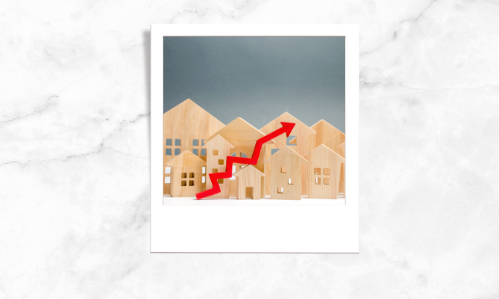 Photo of house blocks with an arrow showing price increase