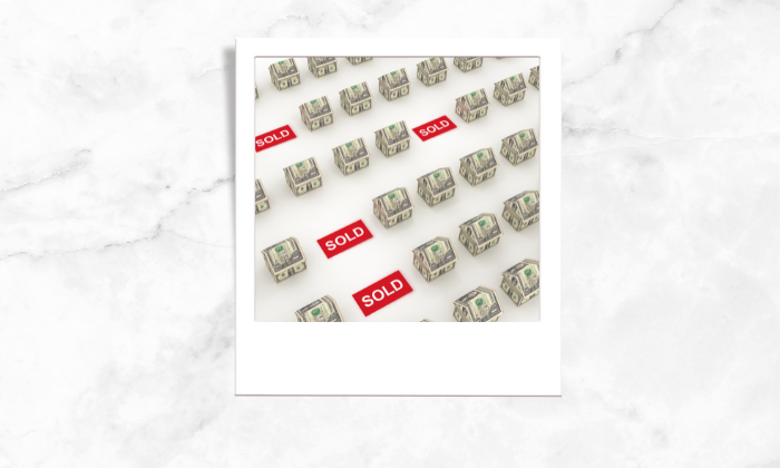Photo of paper bills formed into houses