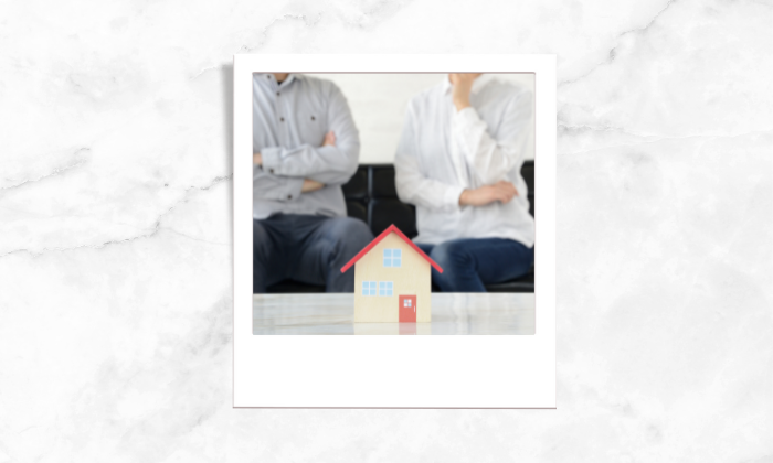 Photo of two people taking behind a house block