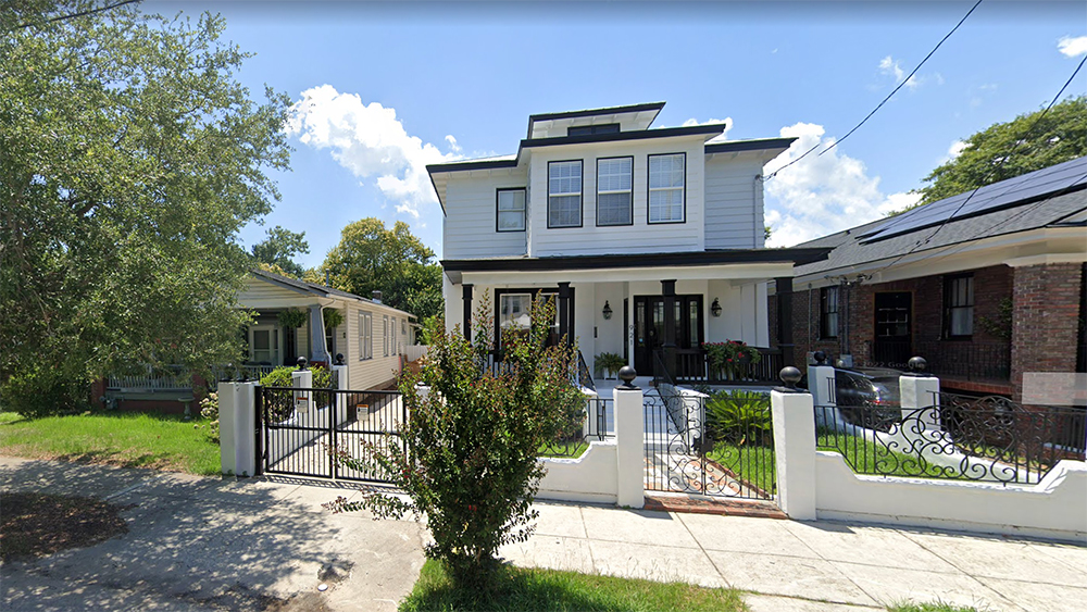 two story white home with black shutters in wagener terrace