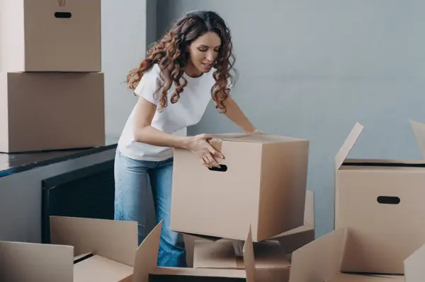 female-tenant-packing-things-in-boxes-to-move-out-2022-10-11-17-38-31-utc
