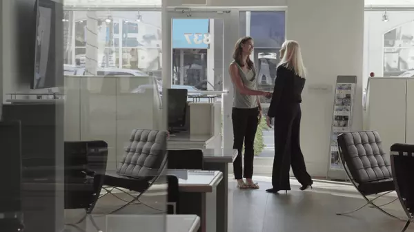 Women Shaking Hands in Shop