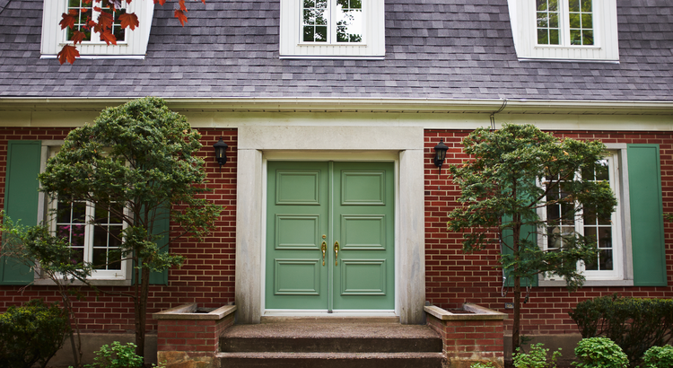 Brick home with green door