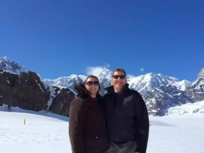 Amy and her husband on top of Mt. Denali in Alaska where he proposed!