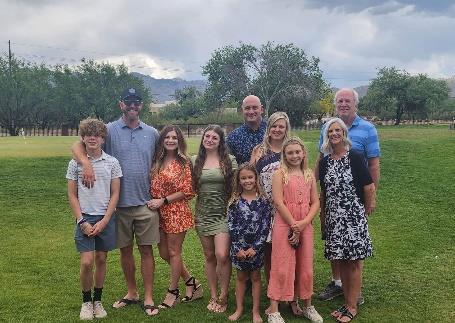 A group of people posing for a photoDescription automatically generated