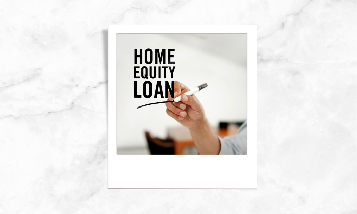 A photo of a person writing home equity loan