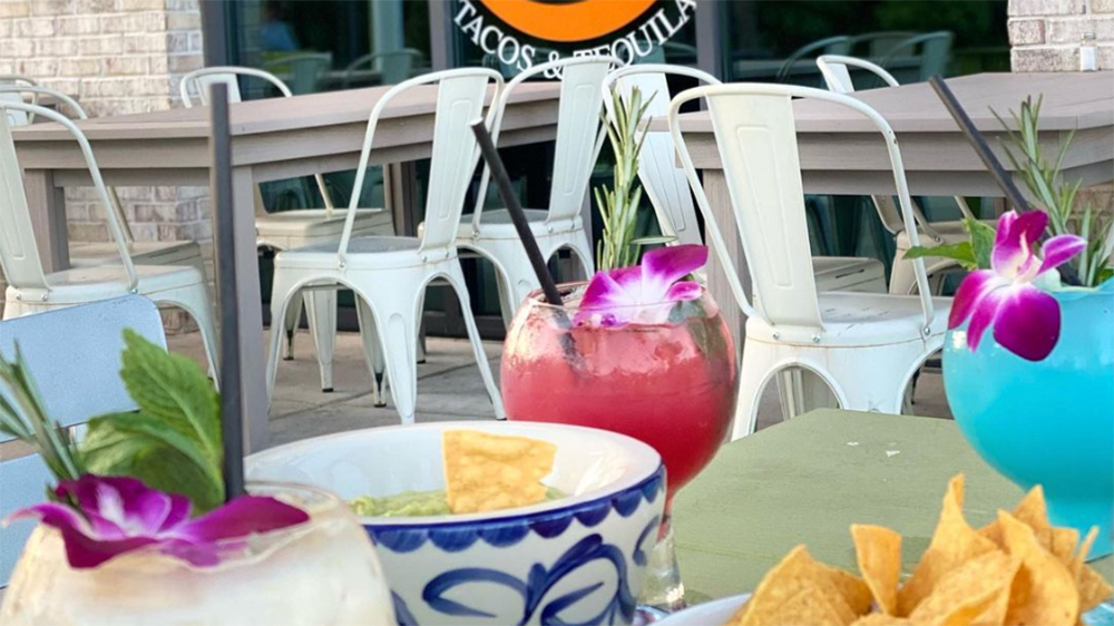 outdoor seating at mi fiesta tacos & tequila of carnes crossroads