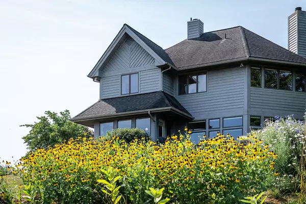 an exterior photo of a house with flowers