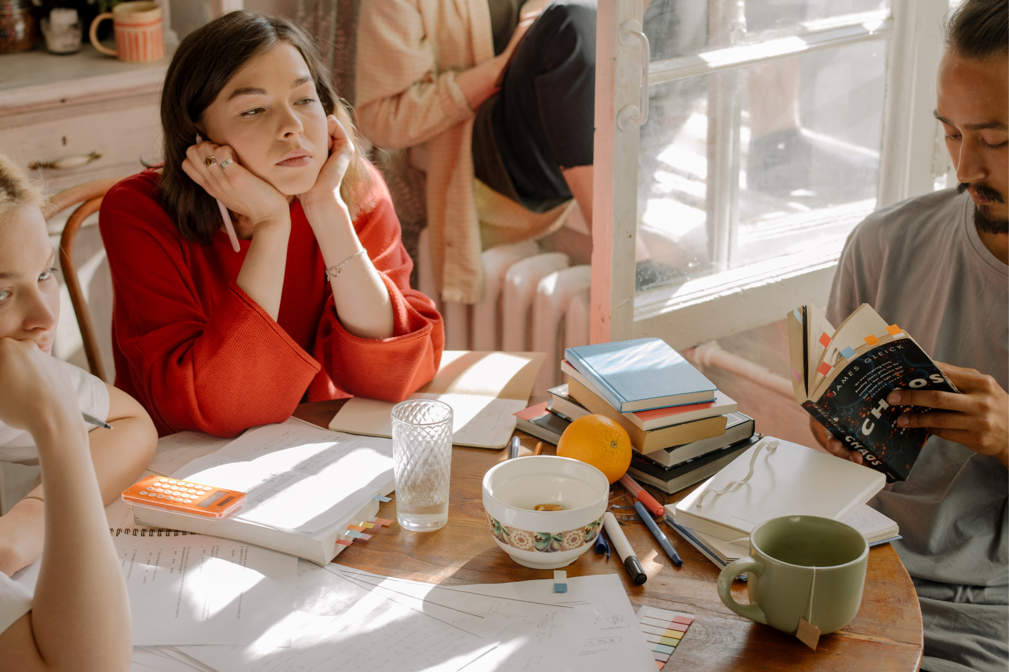 People crowded around a kitchen table