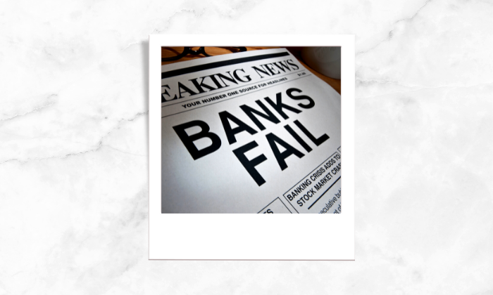 A photo of a news paper with a headline about banks