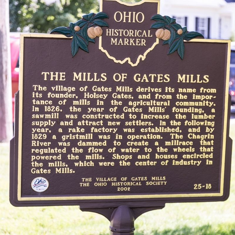 metal brown sign of the Ohio Historical Marker that read The Mills of Gates Mills and tells the story of the village, which is located near homes for sale in Gates Mills Ohio