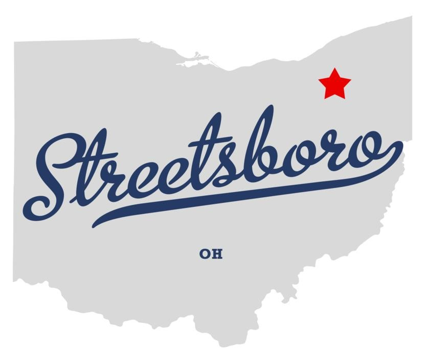 Grey mute map of the State of Ohio with a sign reading "Streetsboro" in blue italics letters, OH at the bottom and with a small red star on the upper right corner used near homes for sale in Streetsboro Ohio