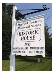 white road sign of the Mayfield Township Historical Society Historic House,  located near homes for sale in Mayfield Village Ohio