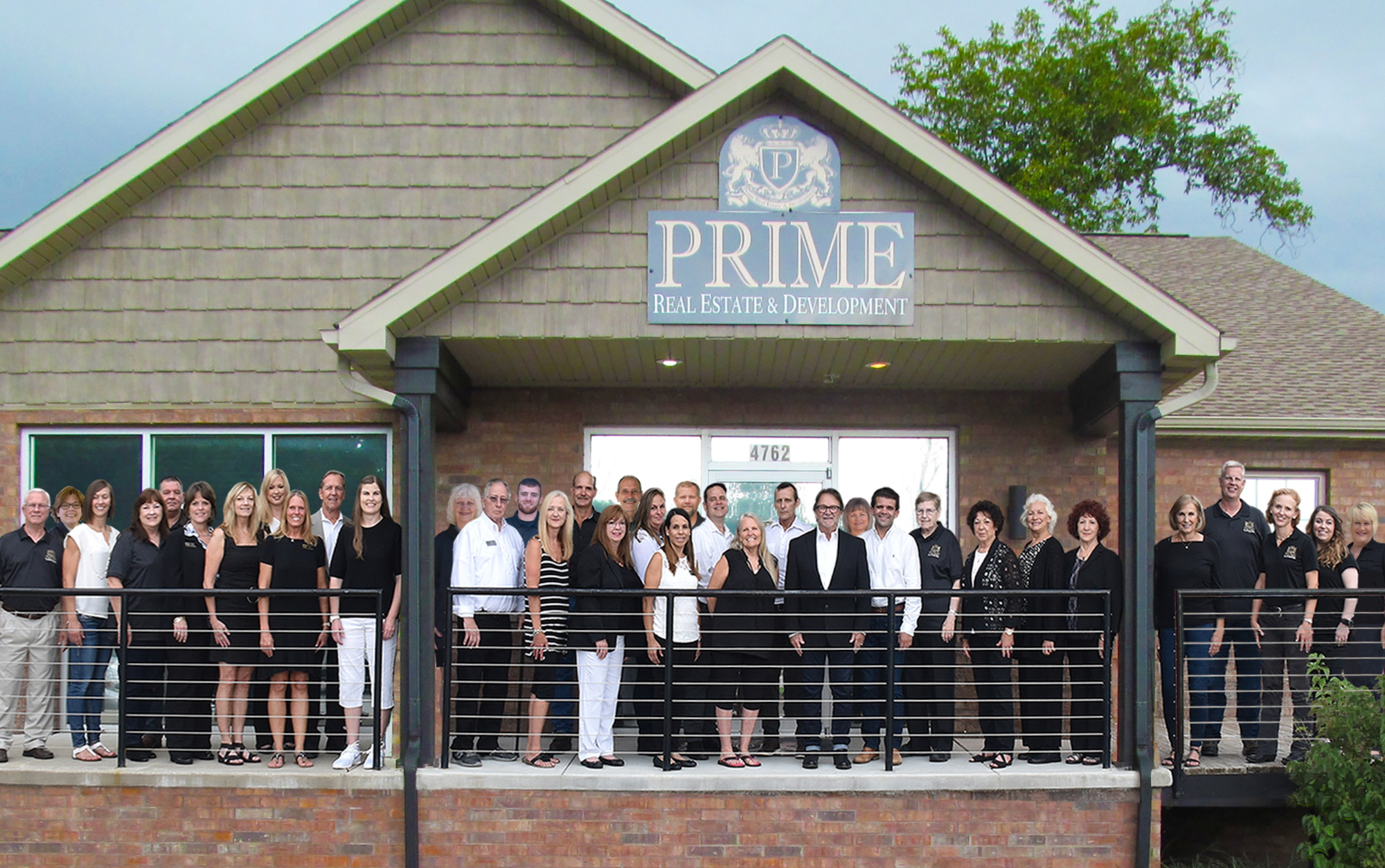 PRIME Real Estate & Development Team in Front of Our Office Building