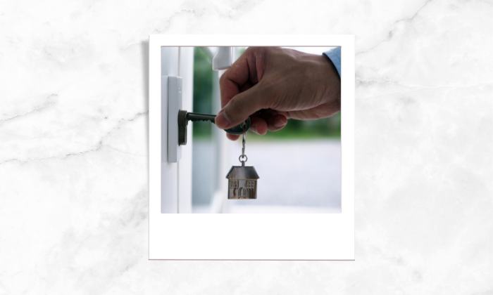 A photo of a homeowner opening his house