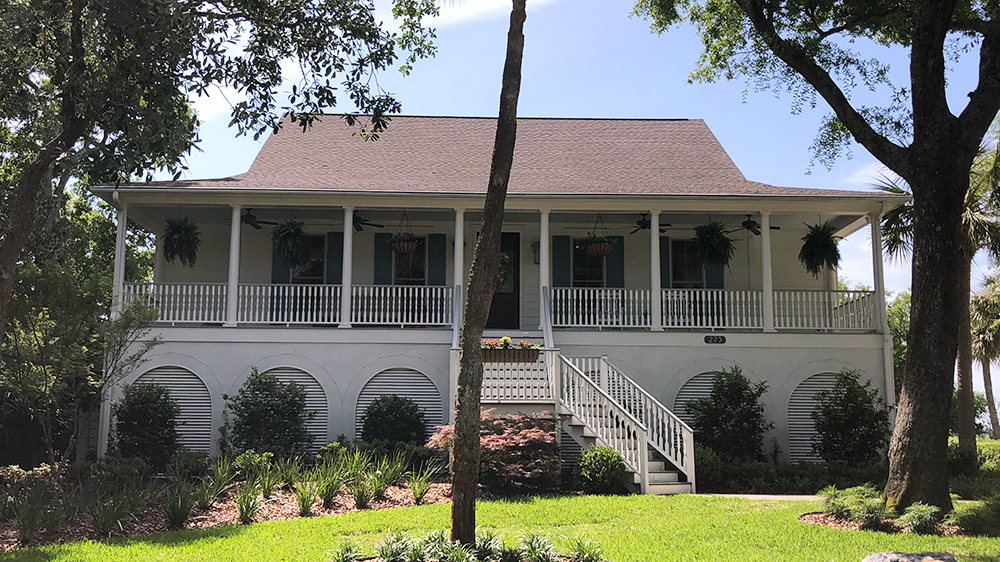 raised home with large front porch in folly beach sc