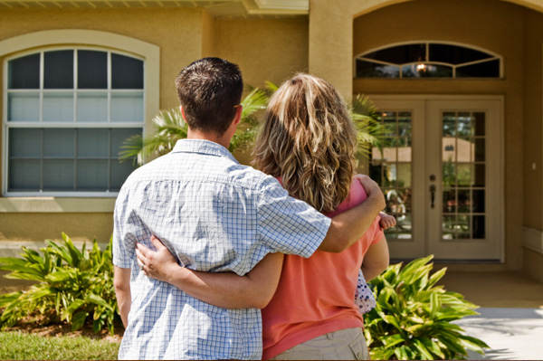 "Image showcasing a potential homebuyer in Miami examining a property listing, symbolizing the crucial steps in the home buying process such as financial readiness, mortgage preapproval, property inspection, and closing a real estate deal in the vibrant Miami market."