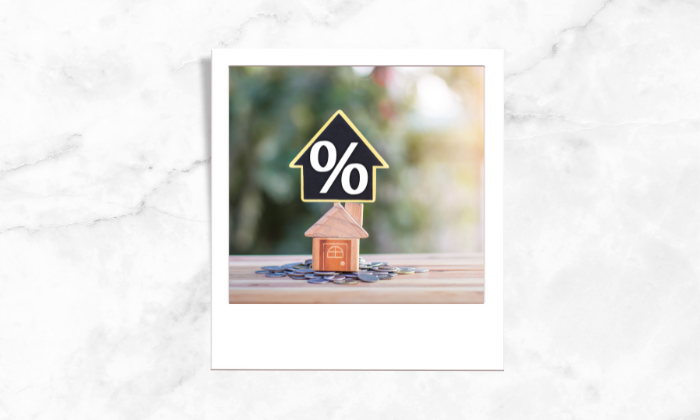 A photo of a house block with a percentage sign above