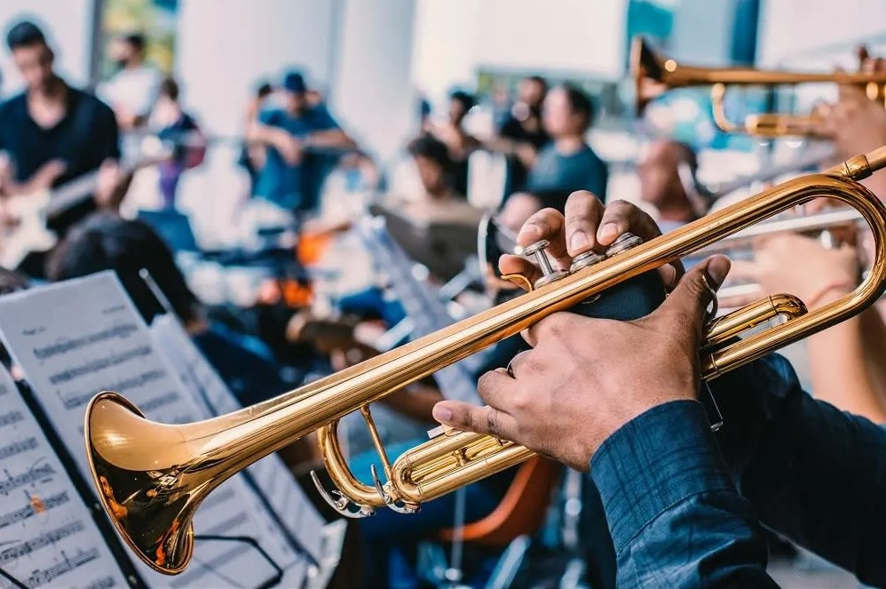 trumpet player playing a trumpet at a family-friendly event